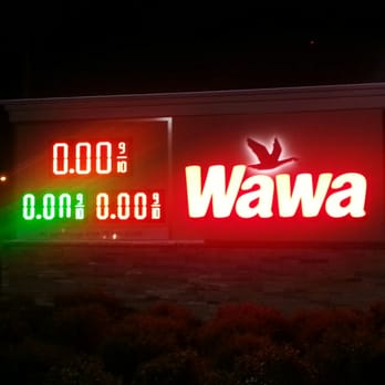 Wawa - a neon sign in front of a gas station - Gas Stations Near Me - Orlando, Florida Wawa - a neon sign in front of a gas station - Gas Stations Near Me - Orlando, Florida