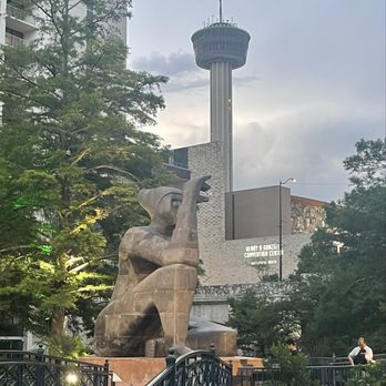San Antonio River Walk - A beautiful view of the Tower of the Americas and one of the art installations from the River - Tours Near Me