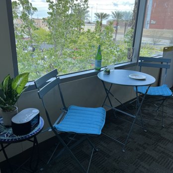 Lafreniere Bistro - a table and chairs on a balcony - Coffee & Tea Near Me - Las Vegas, Nevada