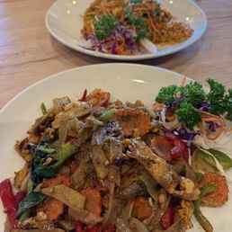 Drunken Man with chicken in front, Shrimp Pad Thai in back. Drunken Man with chicken in front, Shrimp Pad Thai in back.