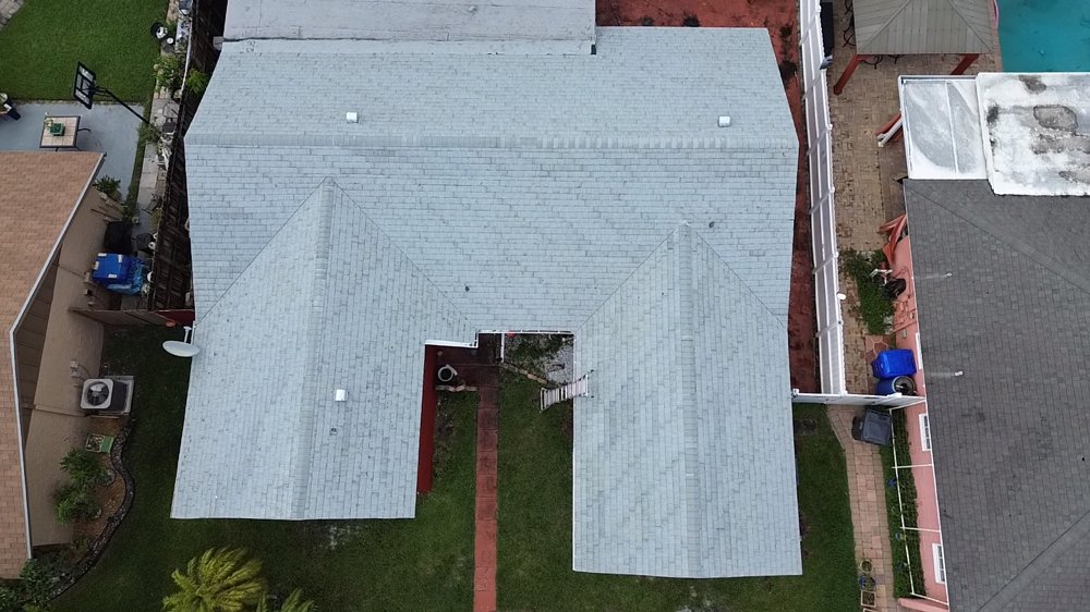 Slide of MC Roofing Service