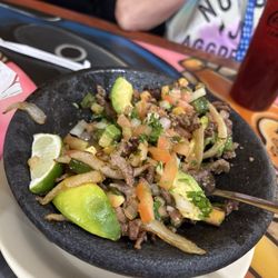 El Caporal Mexican Restaurant & Bar - Guacamole with beef and sautéed onions and green peppers.