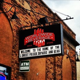 a sign for the home of the lowest priced beers and kegs a sign for the home of the lowest priced beers and kegs
