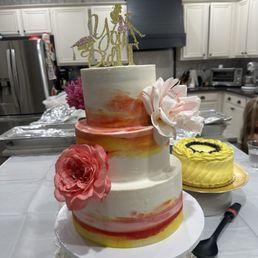 Three tired multi flavor cake. Sunset themed. Three tired multi flavor cake. Sunset themed.