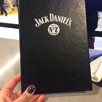 Jack Daniel's - a person holding a black book - Sports Bars Near Me - Oklahoma City, Oklahoma Jack Daniel's - a person holding a black book - Sports Bars Near Me - Oklahoma City, Oklahoma