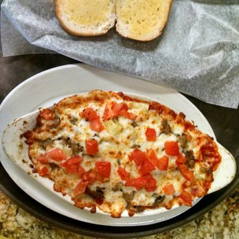 Angelo's Pizza - a slice of bread and a pizza on a plate - Pizza Near Me - Mattoon, Illinois Angelo's Pizza - a slice of bread and a pizza on a plate - Pizza Near Me - Mattoon, Illinois