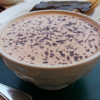 Tacubaya - Mexican hot choco with molé négro tamal in the back - Mexican Near Me - Berkeley, California Tacubaya - Mexican hot choco with molé négro tamal in the back - Mexican Near Me - Berkeley, California