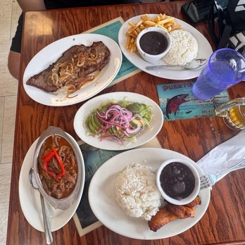 Puerto Sagua Restaurant - Full table, one beer, and a bill that humbled me real quick - Cuban Near Me - Miami Beach, Florida