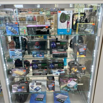 Woodys Smoke Shop - a display case full of electronic gadgets - Vape Shops Near Me - Albion, Michigan Woodys Smoke Shop - a display case full of electronic gadgets - Vape Shops Near Me - Albion, Michigan