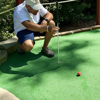 Legendary Golf - Lining up the shot - taking it very seriously - Mini Golf Near Me - Hilton Head, South Carolina