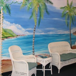 Paradise Sun Tanning - Large screen TV in reception area