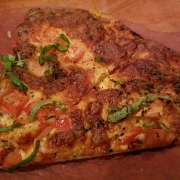 Margarita pizza - overcooked to the point that the cheese was all brown. Margarita pizza - overcooked to the point that the cheese was all brown.