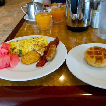 Kuhio Beach Grill - Selections from the buffet:  fruit, breakfast meats, hash brown, freshly made waffle, and made-to-order omelet - Breakfast & Brunch Near Me - Honolulu, Hawaii