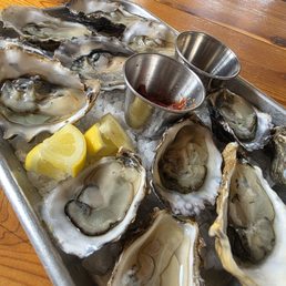 2 tablespoons of mignonette and 2 of cocktail sauce. but skimpy, but alas we never finished the oysters. a bit off,slightly fishy and chewy.