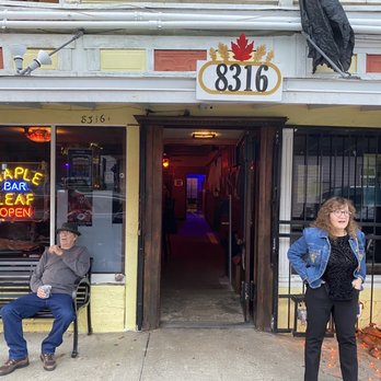 Maple Leaf Bar - two people sitting on a bench - Bars Near Me - New Orleans, Louisiana