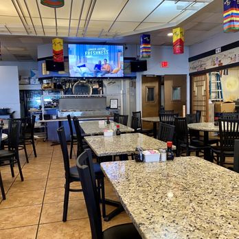 Ilsong Garden - A view toward the kitchen. The sides bar is under the TV. - Korean Near Me - San Antonio, Texas Ilsong Garden - A view toward the kitchen. The sides bar is under the TV. - Korean Near Me - San Antonio, Texas