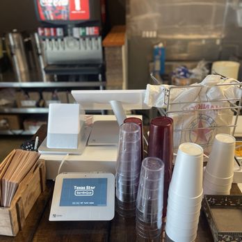 Texas Star BBQ - a counter with a variety of food items - Barbeque Near Me - Hurst, Texas Texas Star BBQ - a counter with a variety of food items - Barbeque Near Me - Hurst, Texas