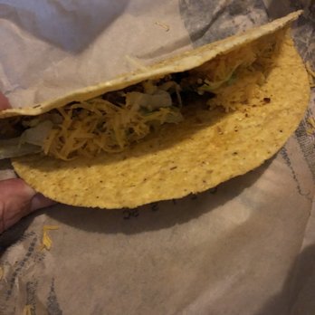 Del Taco - a hand holding a tortilla - Tex-Mex Near Me - Smyrna, Georgia