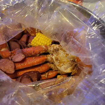 Aloha Krab Cajun Seafood & Bar - 1 cluster crab legs in juicy Cajun sauce $16.50. Comes with potato and corn. The sausage was an add on for $4.99 - Seafood Near Me - Union, New Jersey