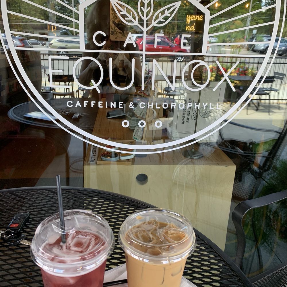 Outdoor in the front of the store, pictured is a hibiscus tea and iced latte