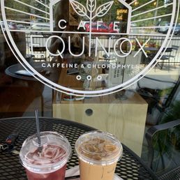 Outdoor in the front of the store, pictured is a hibiscus tea and iced latte Outdoor in the front of the store, pictured is a hibiscus tea and iced latte