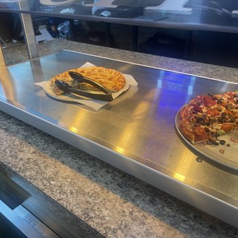 Mountain Mike's Pizza - There pizza bar.   Looks like both pizzas were sitting underneath this warmer for longer than two hours. - Pizza Near Me - Lodi, California
