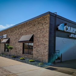 Bloomington Carpet One Floor & Home - Newly painted and re-landscaped building!