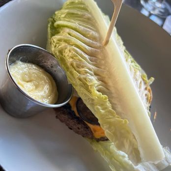 Bar Louie - Winter Park - Truffle Crunch Burger on a lettuce bun with truffle aioli, American cheese, roasted mushrooms, provolone cheese, house chips. - Bars Near Me - Winter Park, Florida