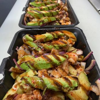 Mariscos Los Mochis - a row of trays of food - Seafood Near Me - Bakersfield, California Mariscos Los Mochis - a row of trays of food - Seafood Near Me - Bakersfield, California