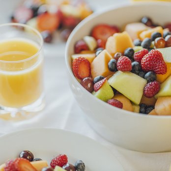 Third Street Bagel - a bowl of fruit salad and a glass of orange juice - Bagels Near Me - Marquette, Michigan