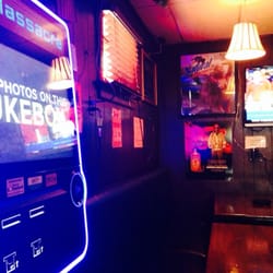 M & M Lounge - Modern Touchtunes jukebox that takes photos and prints them on the spot.