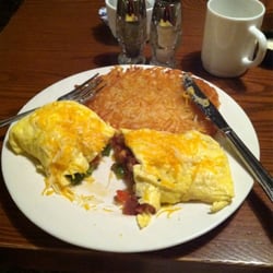 Bistro 13 - 3 egg omelet w/ cheddar, ham, peppers and tomatoes w/ hash browns ($7.25)