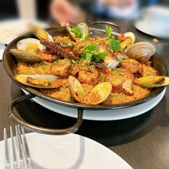 Malbec Argentinean Cuisine - Seafood paella with scallop, mussels, octopus and Spanish rice - Argentine Near Me - Pasadena, California Malbec Argentinean Cuisine - Seafood paella with scallop, mussels, octopus and Spanish rice - Argentine Near Me - Pasadena, California