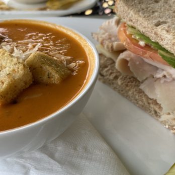 One Flight Up Cafe - Tomato Basil Bisque Half Sandwich Roast Turkey Breast and Swiss - Salad Near Me - Mount Dora, Florida