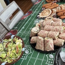 Chicken Cesar salad, lavash sandwich platter, Lahmajoun, meat and potato perashkis Chicken Cesar salad, lavash sandwich platter, Lahmajoun, meat and potato perashkis