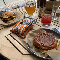 a burger and a drink on a table