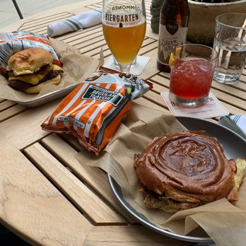 Biergarten - a burger and a drink on a table - Beer Gardens Near Me - Pittsburgh, Pennsylvania