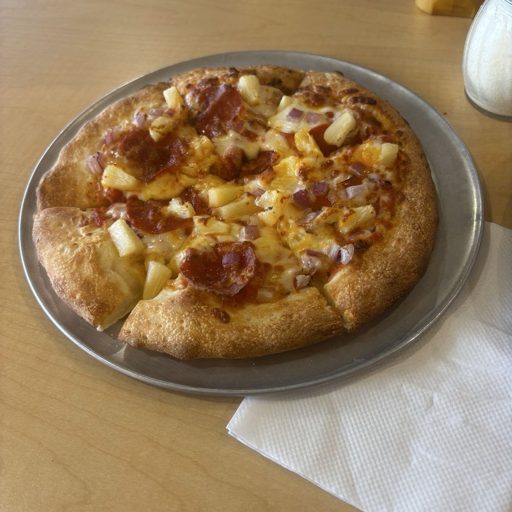 Pineapple pizza with red onions and pepperoni Pineapple pizza with red onions and pepperoni
