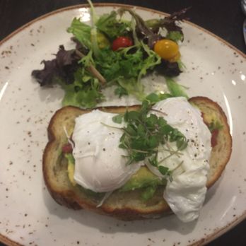 Eques - Poached eggs over smashed avocado toast. - Breakfast & Brunch Near Me - Bellevue, Washington