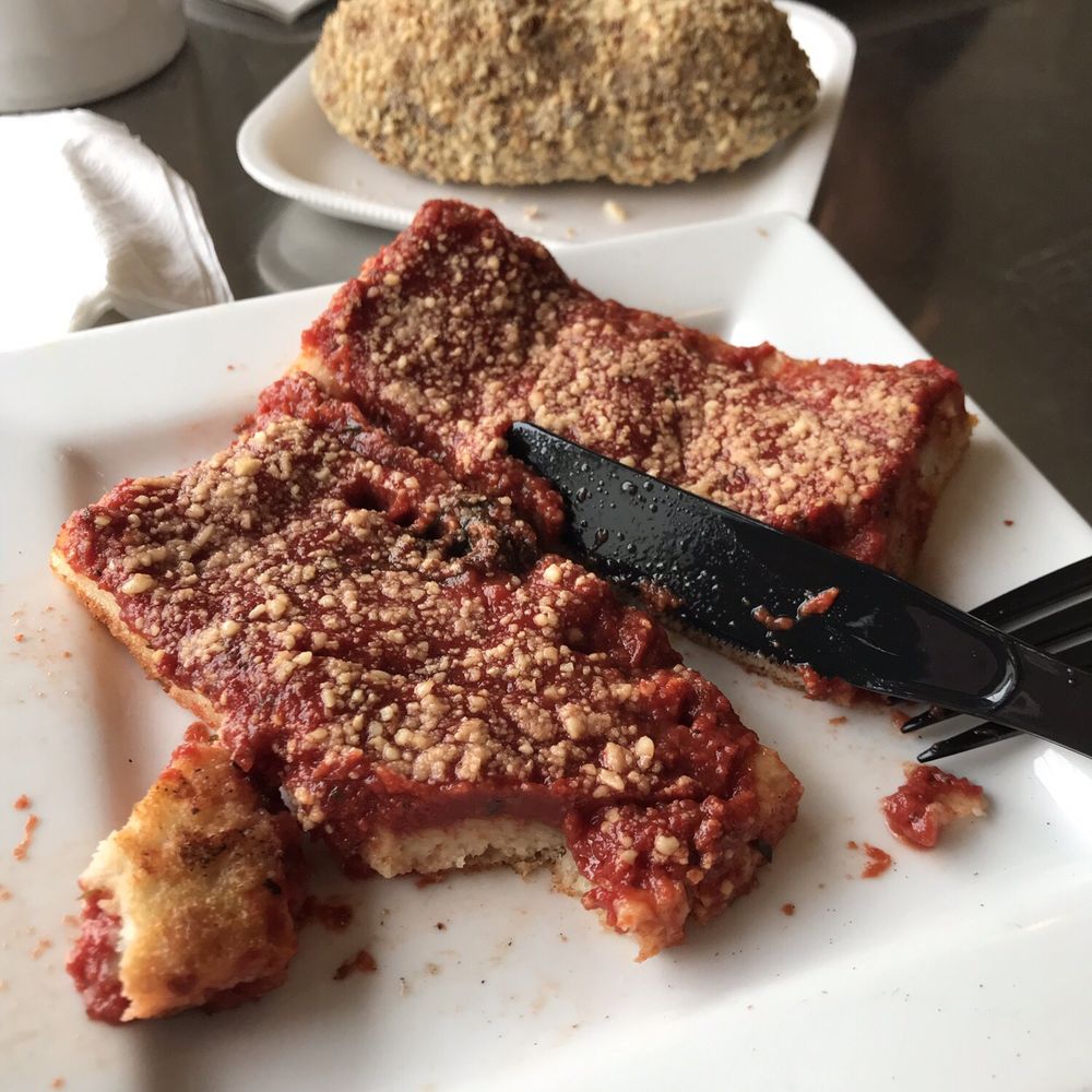 DiCamillo Bakery - Romano pizza square (peanut stick donut and broccoli square pizza in background) - Bakeries Near Me - Williamsville, New York