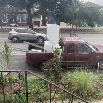 Garden Specialties - Worker securing laundry unit - Nurseries & Gardening Near Me - Kenner, Louisiana