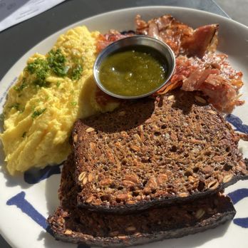 Sqirl - this is the New School plate that comes with scrambled eggs, ham, and house-made bread and hot sauce. - New American Near Me - Los Angeles, California Sqirl - this is the New School plate that comes with scrambled eggs, ham, and house-made bread and hot sauce. - New American Near Me - Los Angeles, California