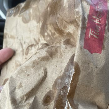 Tim Hortons - a person holding a bag of food - Coffee & Tea Near Me - Eden, New York Tim Hortons - a person holding a bag of food - Coffee & Tea Near Me - Eden, New York