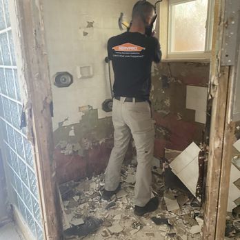 Servpro - Our techs hard at work demoing a damaged bathroom--clearing the way for a clean, safe rebuild. - Damage Restoration Near Me - San Diego, California Servpro - Our techs hard at work demoing a damaged bathroom--clearing the way for a clean, safe rebuild. - Damage Restoration Near Me - San Diego, California