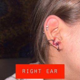 Right ear and 20G hoops on double and triple lobes.