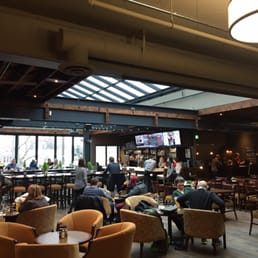 people sitting at tables in a restaurant people sitting at tables in a restaurant
