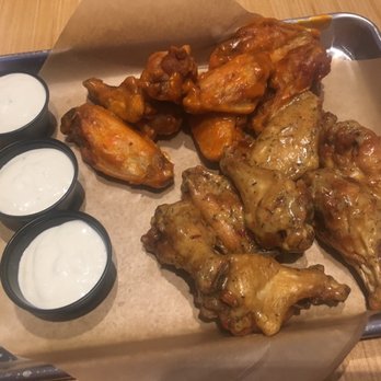 Buffalo Wild Wings - Medium traditional wings. Half buffalo medium and half Parmesan garlic with bleu cheese - Sports Bars Near Me - Waco, Texas