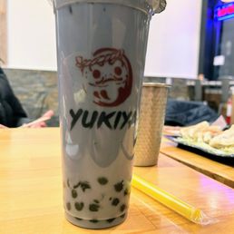 a drink in a plastic cup on a table a drink in a plastic cup on a table