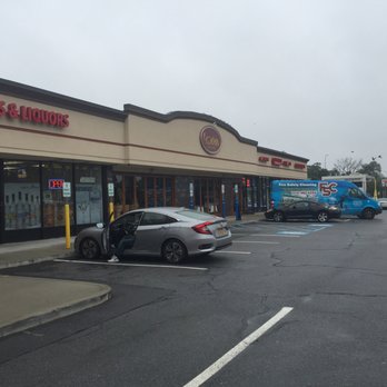 Jericho Liquor - a car parked in front of a liquor store - Beer, Wine & Spirits Near Me - Mineola, New York
