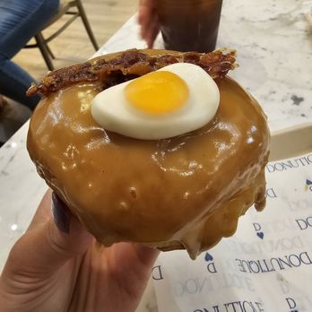 Donutique - Maple bacon do donut, it has a gummy egg on top. Fantastic donut. - Coffee & Tea Near Me - Las Vegas, Nevada